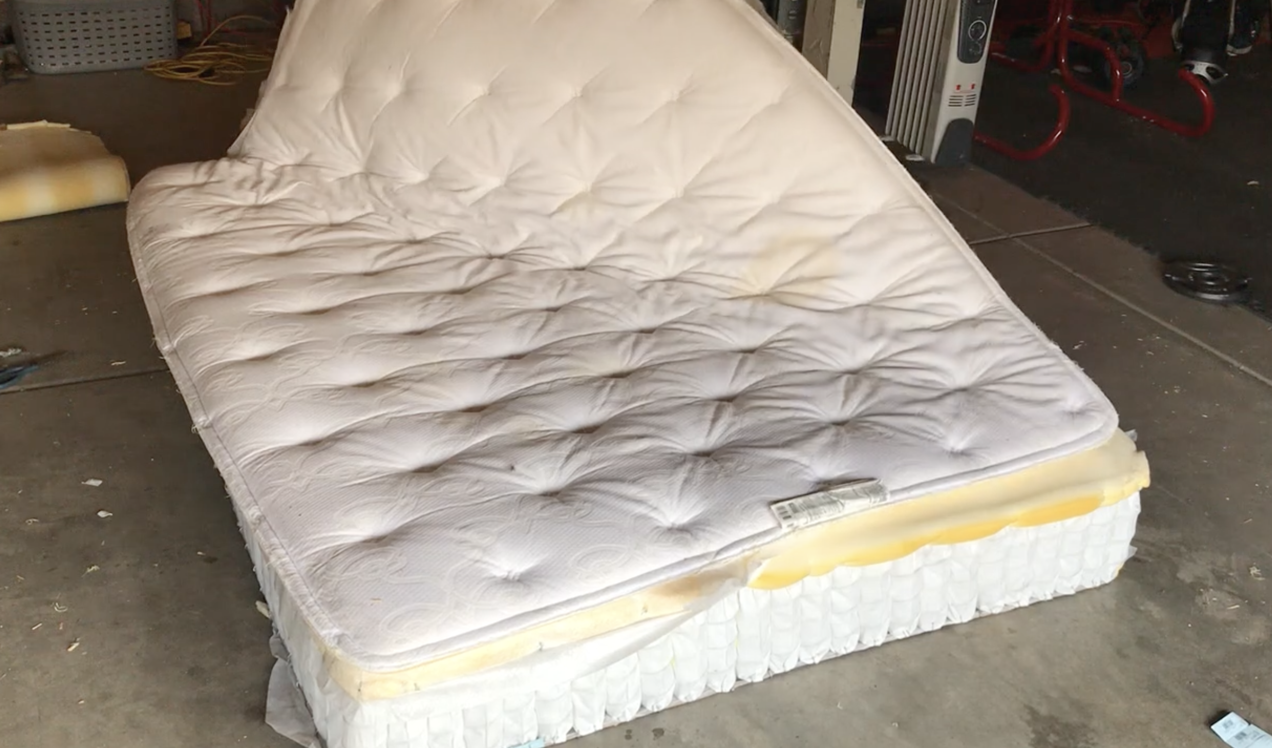 Worker cutting mattress cover